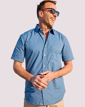 model wearing blue button-down short-sleeved shirt