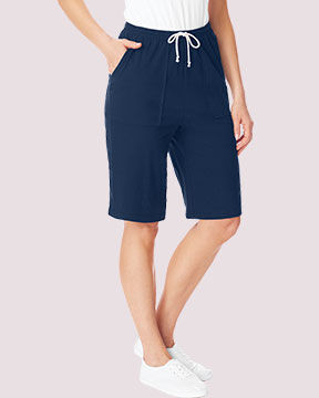 bottom half of model wearing dark blue shorts