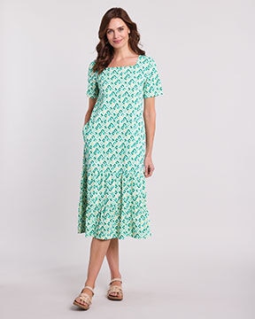 model wearing green patterned dress