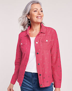 smiling woman wearing pink jean jacket with white t-shirt
