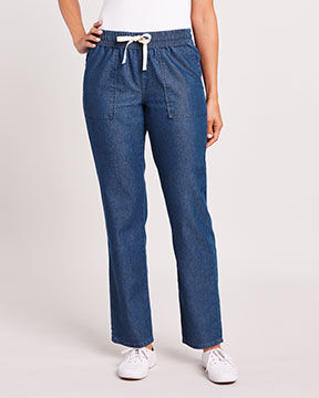 bottom-half of model wearing dark blue denim jeans